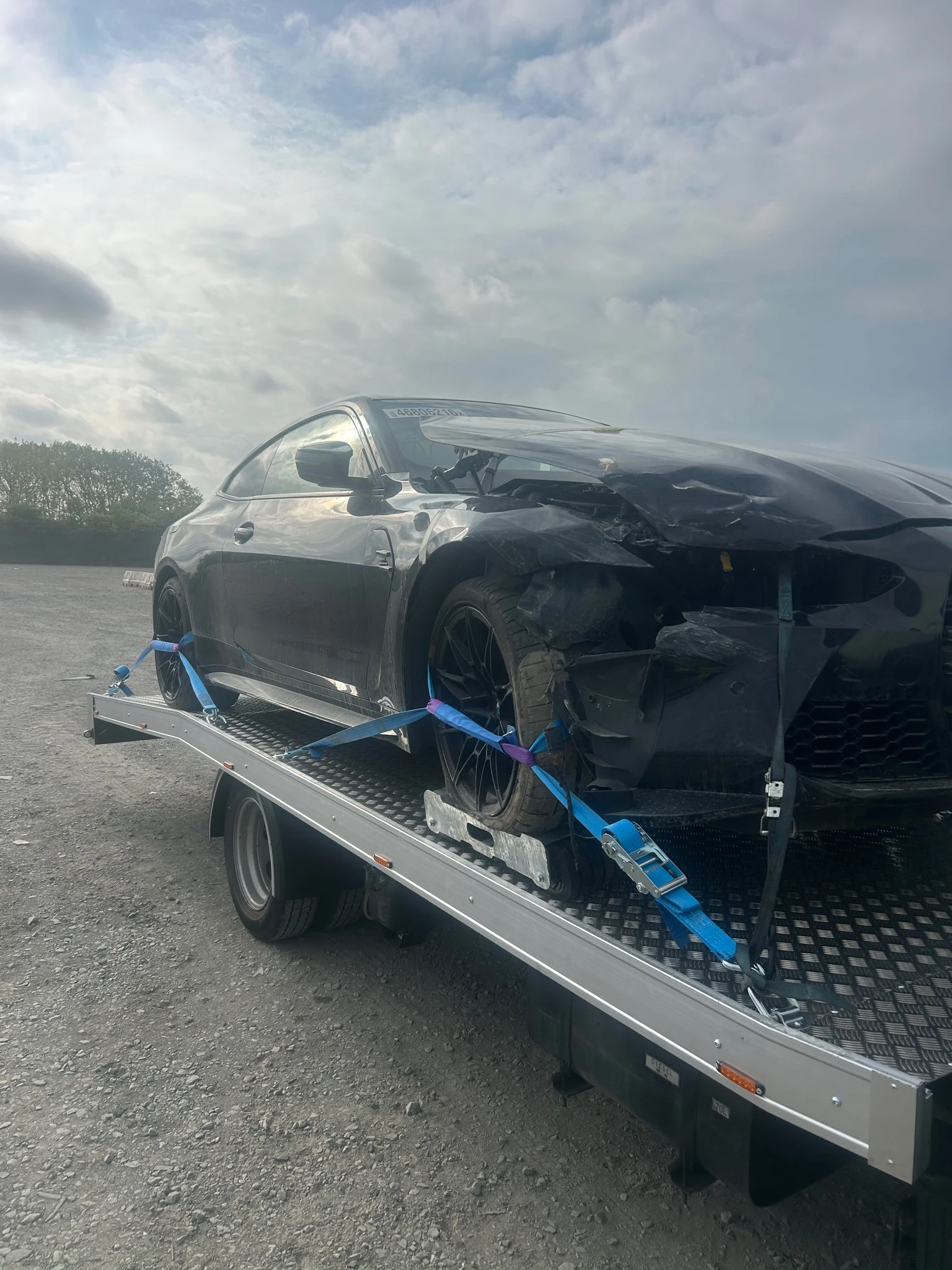 Copart auction vehicle loaded on recovery truck