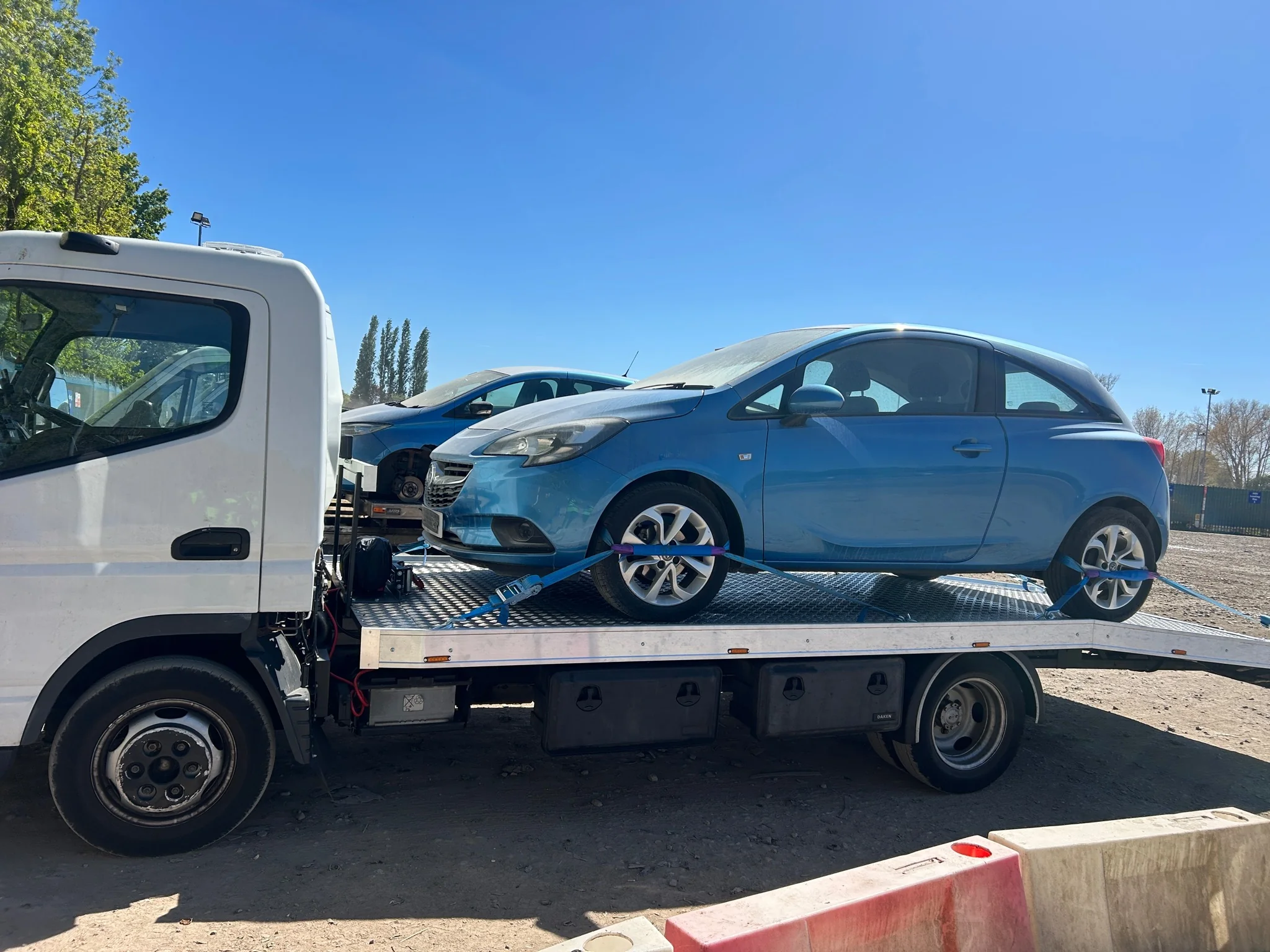 Auction vehicle recovery truck collecting salvage car